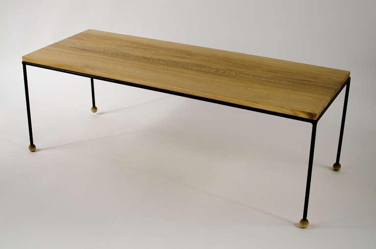 Custom coffee table inspired by Paul McCobb and Greta Grossman, features a stunning, solid sycamore top with a solid black iron frame and ball feet. 

This item is also available for a custom order. Lead time is about six weeks. Various hardwoods