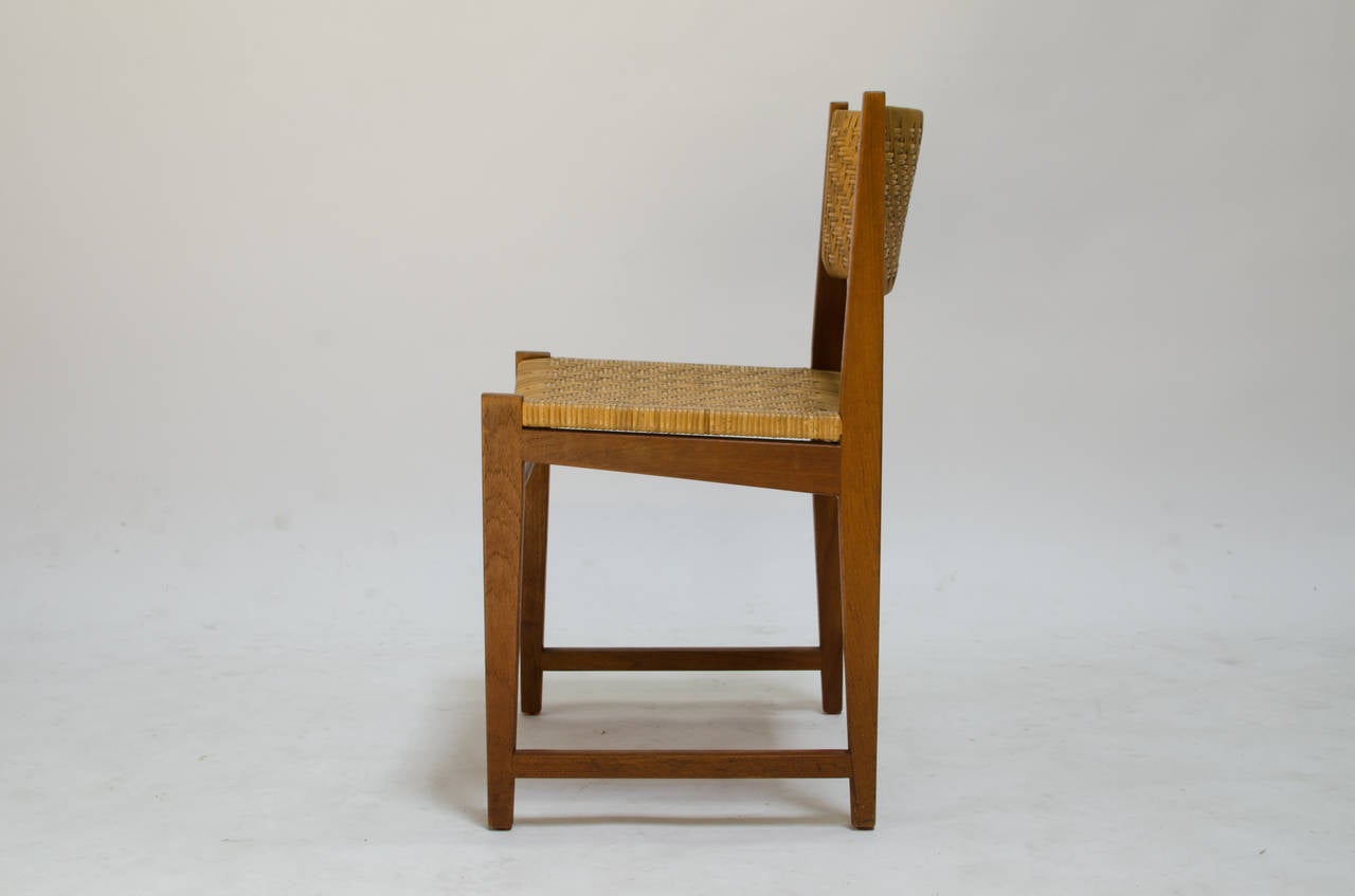 A beautiful teak side chair by Peter Hvidt and Orla Mølgaard Nielsen for Soborg Mobelfabrik. Model #350/Cane
A rare design not usually found in the US.
The solid teak frame is gorgeous and combined with original cane seat and back, makes for a