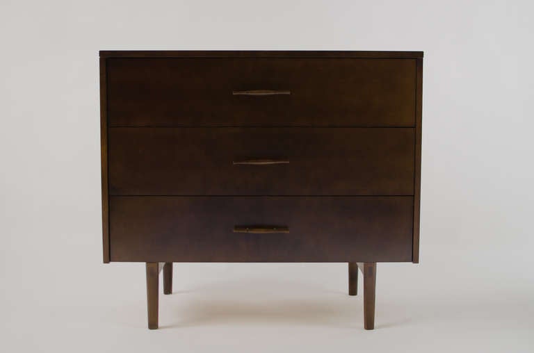 Elegant three drawer dresser designed by Paul McCobb for the Planner Group series. Beautiful dark walnut with 