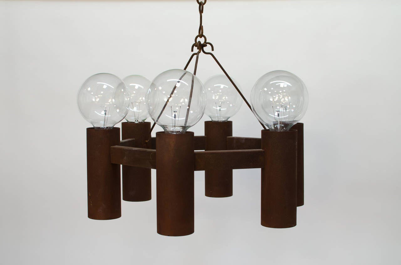 Stunning hanging chandelier designed by Stuart Barnes for Robert Long Lighting, c.1960s, California. Six arm canister lights which are double sided to produce an amazing top and bottom glow. There is a switch on the inside to toggle between top and