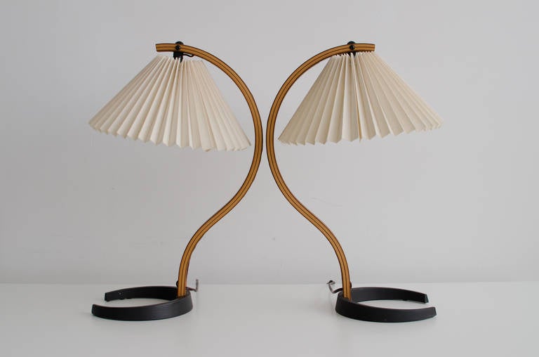 Beautiful pair of molded plywood and iron table lamps with original pleated shades designed by Caprani.