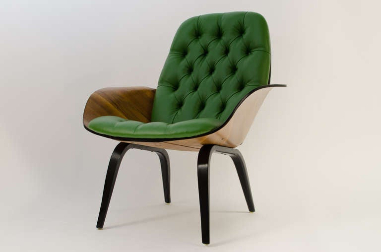 Stunning and rare molded plywood lounge chair designed by George Mulhauser for plycraft, circa 1950s. Wood shell shows a dramatic walnut grain with incredibly soft fern green ultra leather.