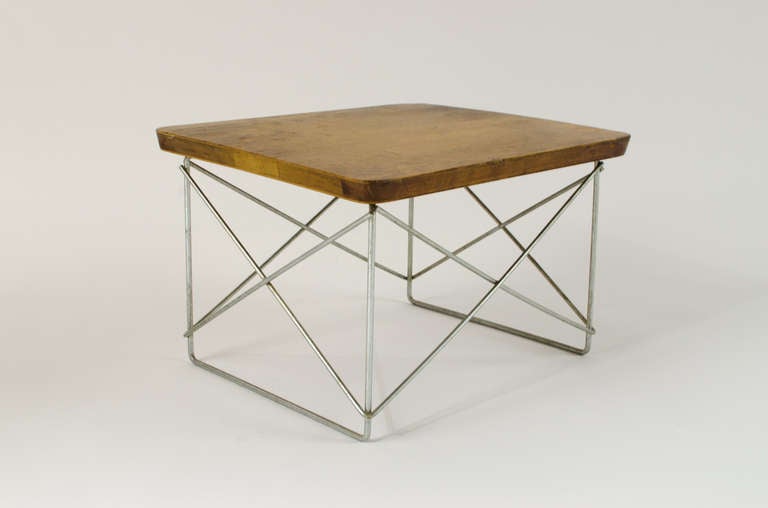 Beautiful and simple. Small low wire table designed by Charles & Ray Eames for Herman Miller. Excellent original patina.