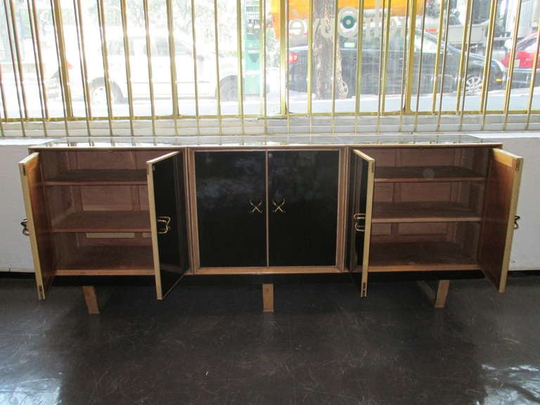 Architect Fernando Barabara (Mexico) Wood and formica  credenza builted in three separate modules over a Herman Miller George Nelson style bench and knobs.
ca. 1956