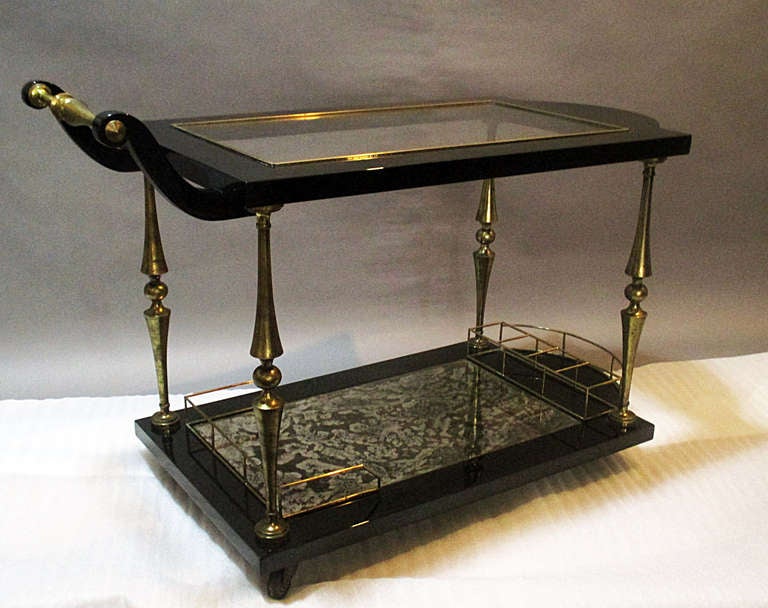 Arturo Pani black lacquered wood and brass and glass serving trolley
Recently restored (lacquered)