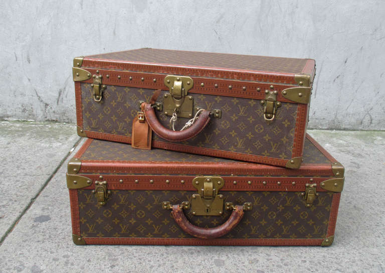 Pair of Louis Vuitton Alzer Vintage Suitcases

Bigger size: height 9 x width 26 x depth 20 inches
Smaller size: height 9 x width 24 x depth 16 inches