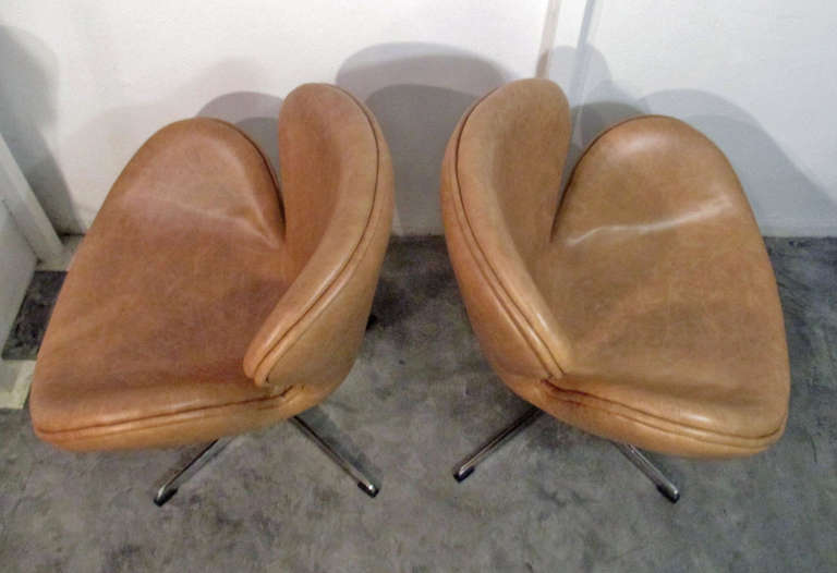 Pair of Swan Chairs by Arne Jacobsen. Recently restored in leather.