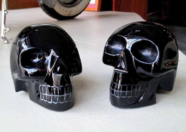 Pair of skull book ends made of carved obsidian