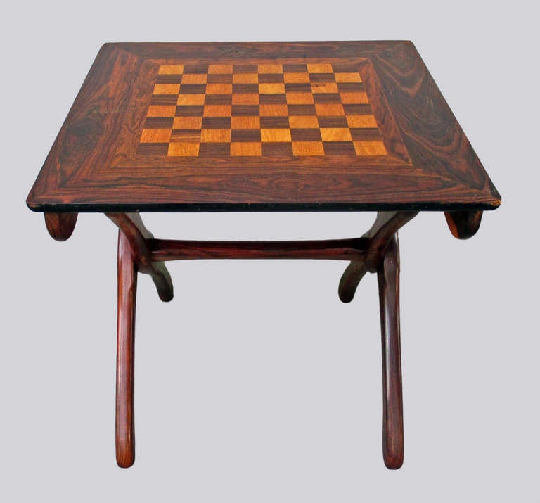 Don Shoemaker Folding Chess Table Tropical Woods

Don Shoemaker was an american designer who lived and worked in Michoacan, Mexico. He is actually considered one of the most important Mexican Modernism exponent and is his style is characterized by