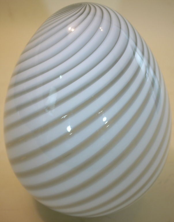 Murano egg lamp by Venini.<br />
<br />
Venini. The largest and most successful of the Murano glass furnaces, still in business in Murano. Established in 1925 by Paolo Venini. Venini embraced Modernism trends in art and architecture with their new