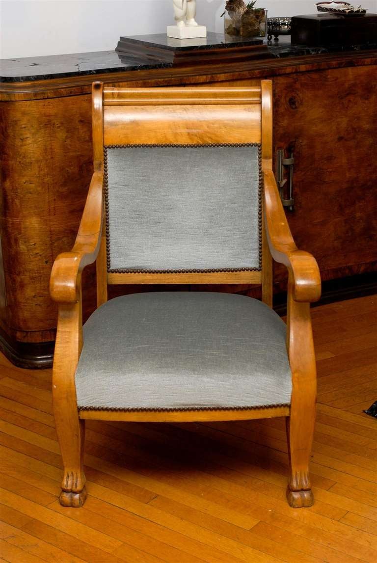 19th Century Biedermeier arm chair with down swept arms and hoof feet.