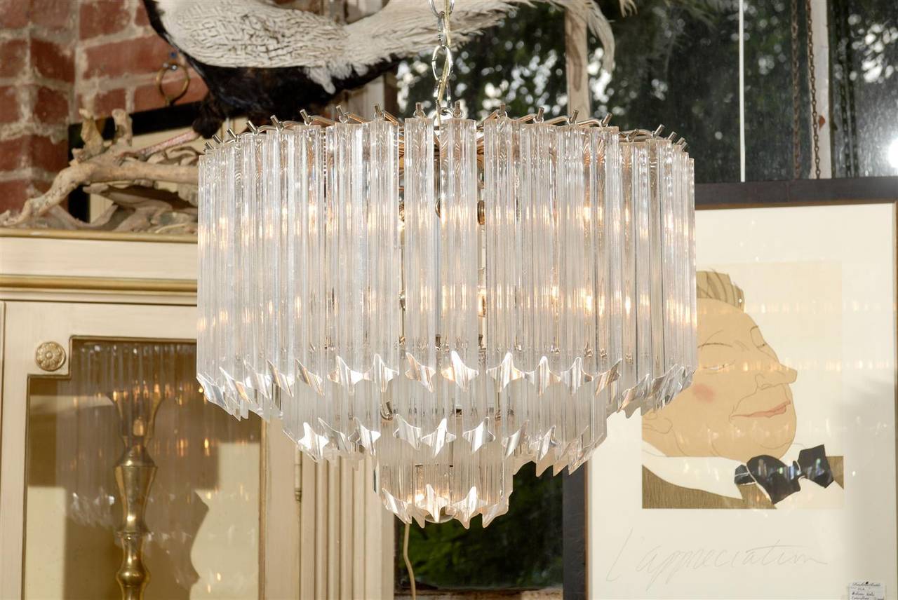 Midcentury chrome and lucite prism waterfall three tier chandelier.