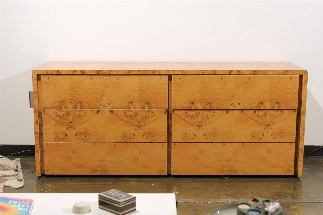 Fine quality vintage four piece set of burl wood furniture with intricately laid bookplate veneers. The suite includes a six-drawer credenza, a three drawer chest, and a pair of side cabinets or nightstands.

The measurements are as follows: