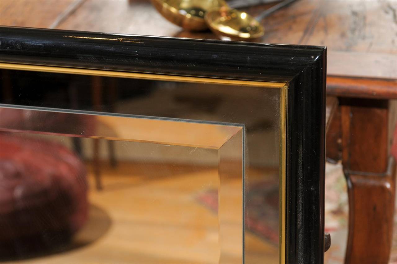 American Smoked and Beveled Glass Wall Mirror in a Black and Brass Frame