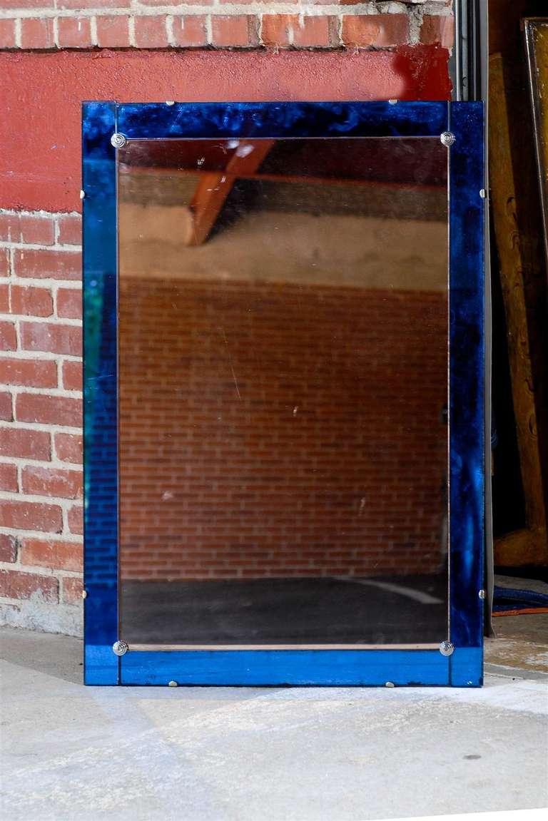 Early 20th Century Italian mirror of the Art Deco period having a cobalt blue mirrored frame.