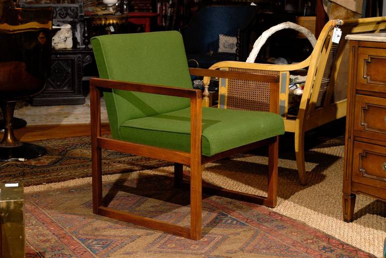 Mid 20th Century armchair of teak with original upholstery.