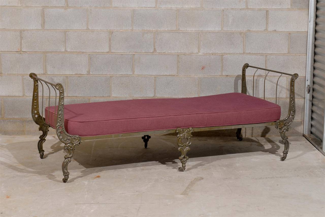 19th Century Victorian roll away or folding day bed or sofa of ornate cast iron and steel with custom mattress.  The mattress measures 69