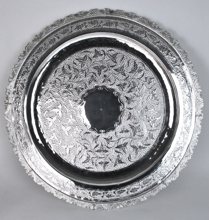 Moroccan Silver Plated Brass Coffee/Tea Table.  This exquisitely decorated circular table, sometimes called a Low Table, is suitable for serving coffee and tea or displaying magazines. The table is of the highest quality and is decorated with 