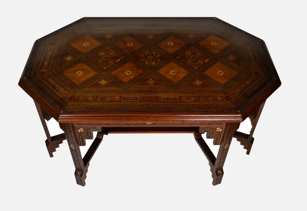 Arabesque Octagonal-shaped Syrian carved wood table in the Moorish style. Mother-of-pearl and several exotic woods, inlaid.