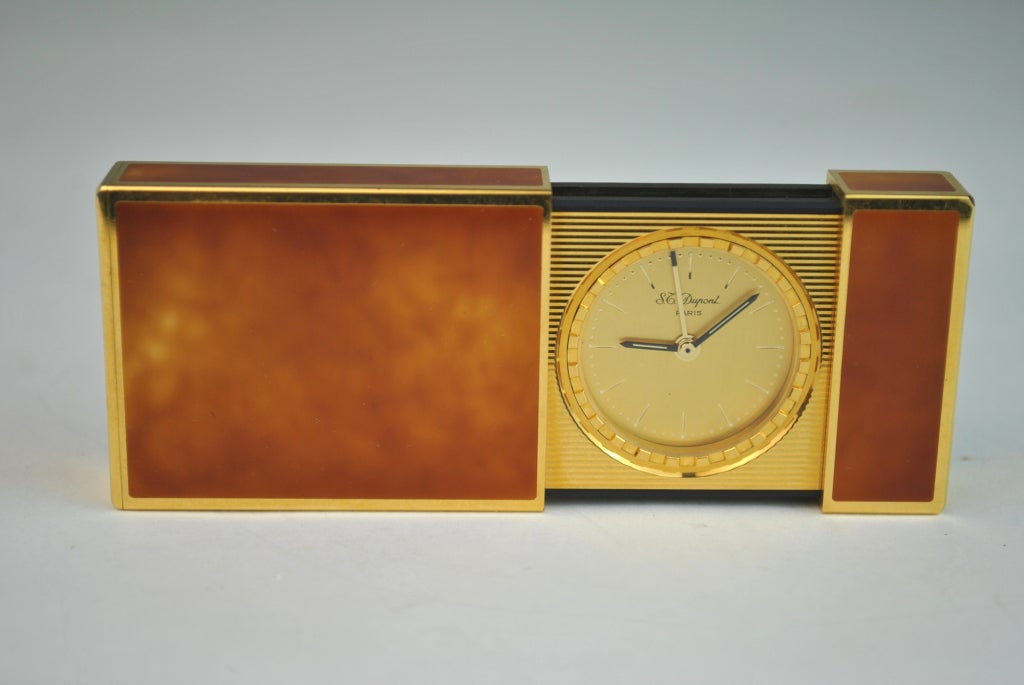 S.T. Dupont Chinese Lacquered series orange Traveling Alarm Clock in original black box. Out of production. Stored in a warehouse for many years. 

Clock: 3.75