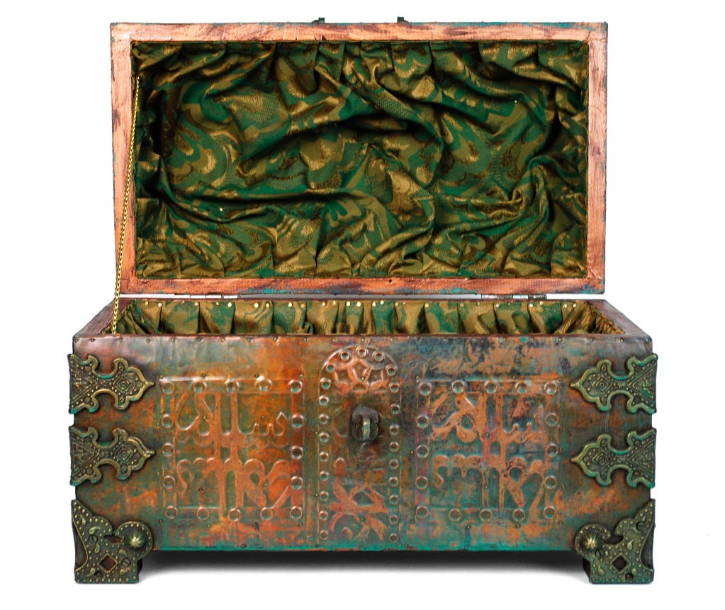 Persian Round-Top Chest. Handmade wooden chest with Hand embossed metal applied to each side and top. Interior lined with emerald-colored cloth with floral design. Bronze latches, handles, and corner reinforcements decorated with geometrical motifs