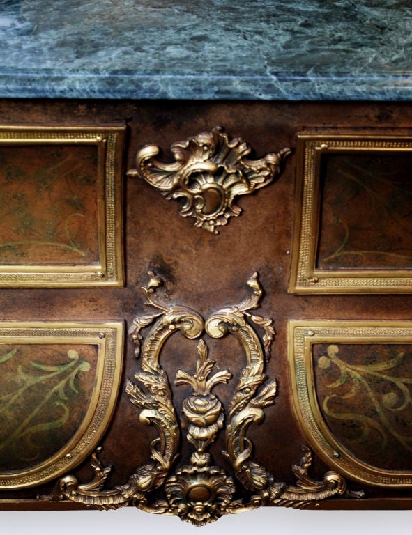 Louis XIV-Style Bombe Commode. 4-drawers. Marble top. Ormolu mounts. Paw legs. Surface on front of drawers in a manner resembling Andre-Charles Boulle's brass and tortoiseshell treatment. Facial motifs on hardware and mounts.