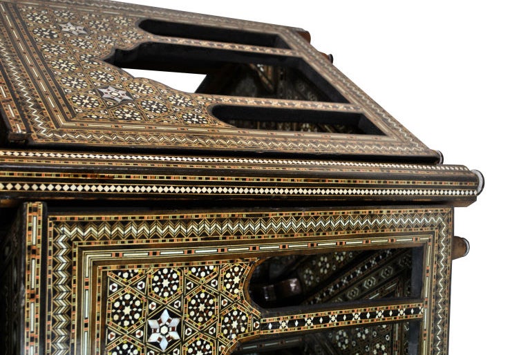 Syrian Mother-of-Pearl Hexagonal Table with Six Triangular Occasional Nesting Tables. This piece is in mother-of-pearl and wooden mosaic inlay. One side of each of the triangular occasional tables is in Moorish-style open arches.