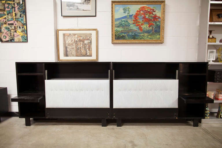 Classic George Nelson design for the Herman Miller Collection of the early 50's, this pair of walnut King headboard storage units with bedside shelves and table are quite beautiful and utile. The padded headrests are individually adjustable and when