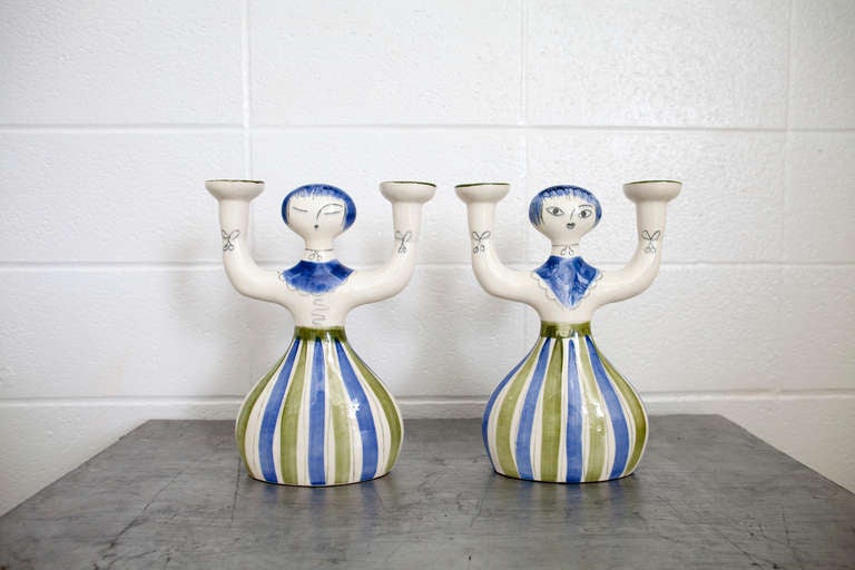 Nice pair of Hedi Schoop for California Pottery candleholders. One side has open eyes and other shut. Very sweet pair.