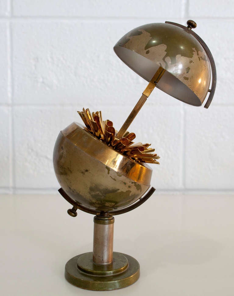 Mid-Century Steel And Brass Globe Cigarette Holder. Great conversation piece.