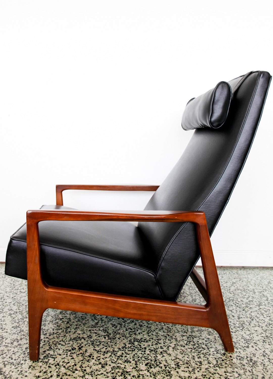 Beautiful fully reclining Danish lounge chair. Removable headrest pillow and pull-out foot rest. Smart, Classic design.
