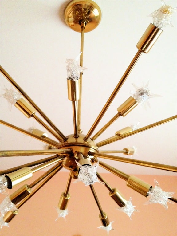 Very nice all original 24 arm sputnik chandelier. Very nice condition. Just pulled from a one owner estate. Two star bulbs missing and some broken. These are thrown in with the chandelier if buyer wishes. We can also provide new white blobe bulbs as
