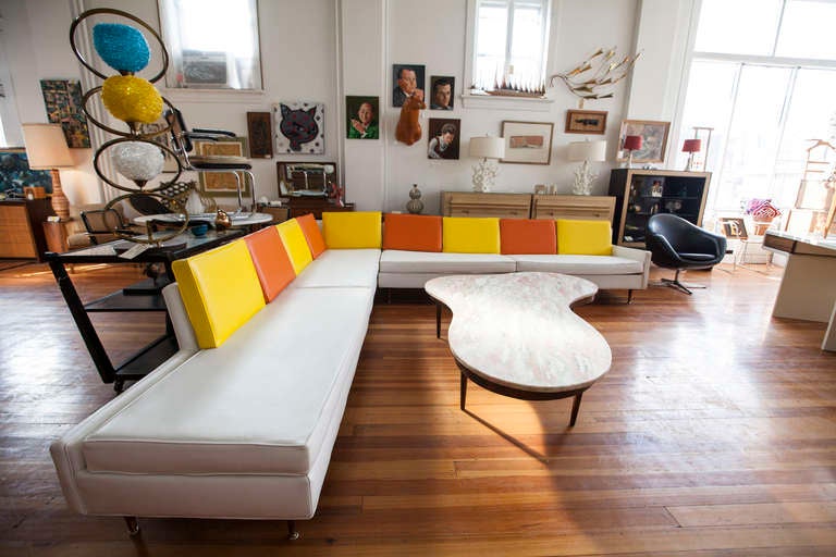 Large Mid-Century Modern sectional sofa in original white, yellow and orange upholstery. 