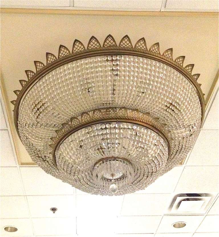 Beautiful impressive chandelier with glass crystals. There are a total of 6 available. The last photo is an example of one lit up. They are 2 tiered, not three.