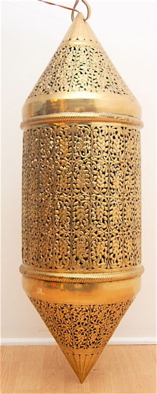 Pierced brass Moroccan light fixture. Swag light with hook. Very nice diffused light. Made in India.