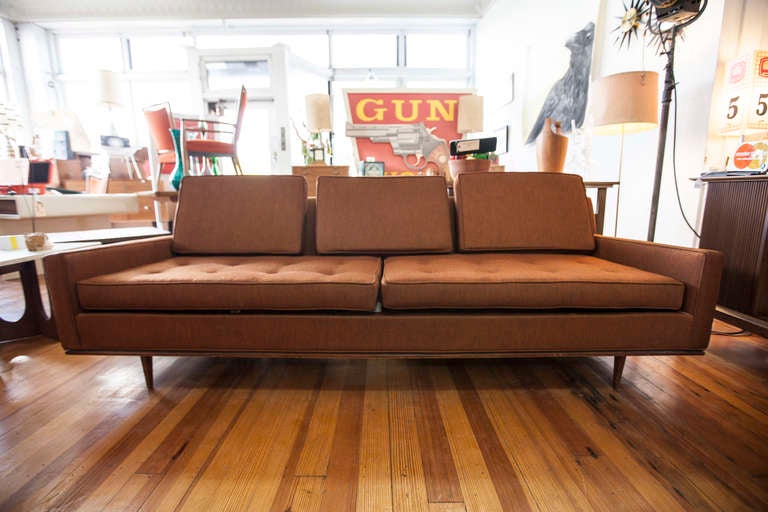 Very nice long Selig sofa with new cushion foam. Two button tufted seat cushions and three back cushions. 