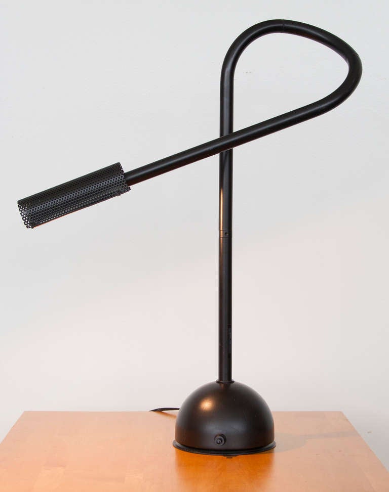 Hans Ansems desk lamp, adjustable at five different points. Lamp uses halogen light for a bright and controlled illumination. Base is weighted with on and off switch.