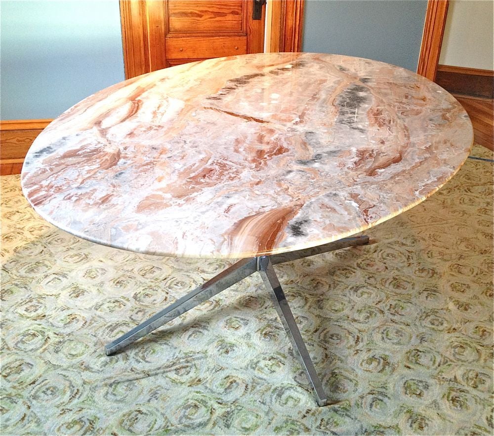 Very nice Florence Knoll marble oval table. Can be used as a dining table or desk. Original table with chrome star base designed by Florence Knoll. USA, circa 1960. This piece is all original and was manufactured by Knoll. Beautiful original design.