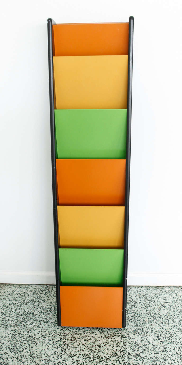 Very nice mid-century wall mount magazine rack by Peter Pepper. Two available.
