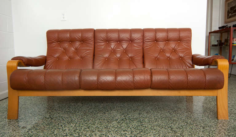 Very nice brown leather sofa with button tufted seat and back. Danish modern origin. Original condition.