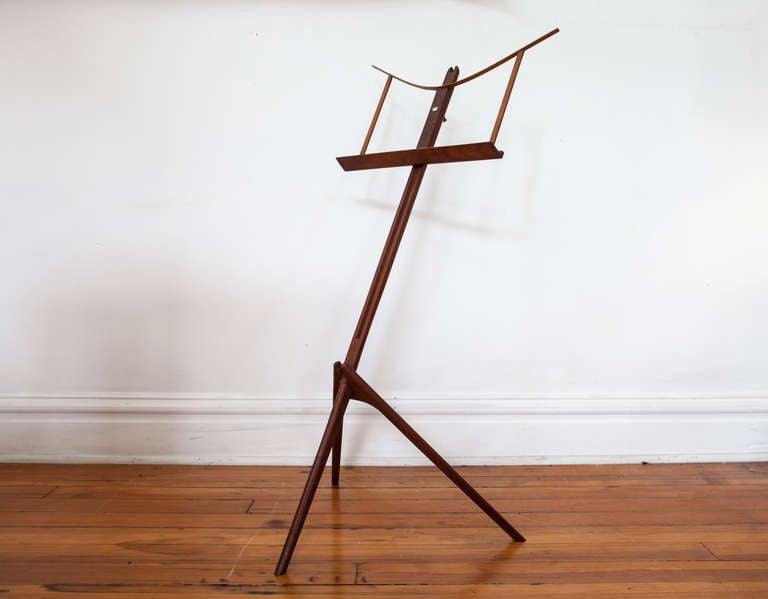 Exceptional teak music stand with sculptural base. Made of teak. Mid-Century design. 