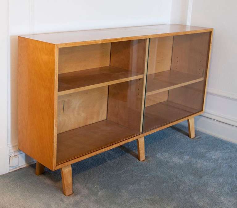 Rare Clifford Pascoe bookcase with glass sliding doors and two adjustable shelves. Made of birchwood.
