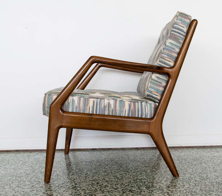 Beautiful pair of Danish mid-century modern teak lounge chairs by France and Sons. Newer upholstered eat cushions.