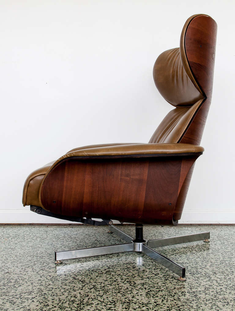 Danish Leather and Bentwood Reclining Lounge Chair by Plycraft. Built in footstool with reclining back.