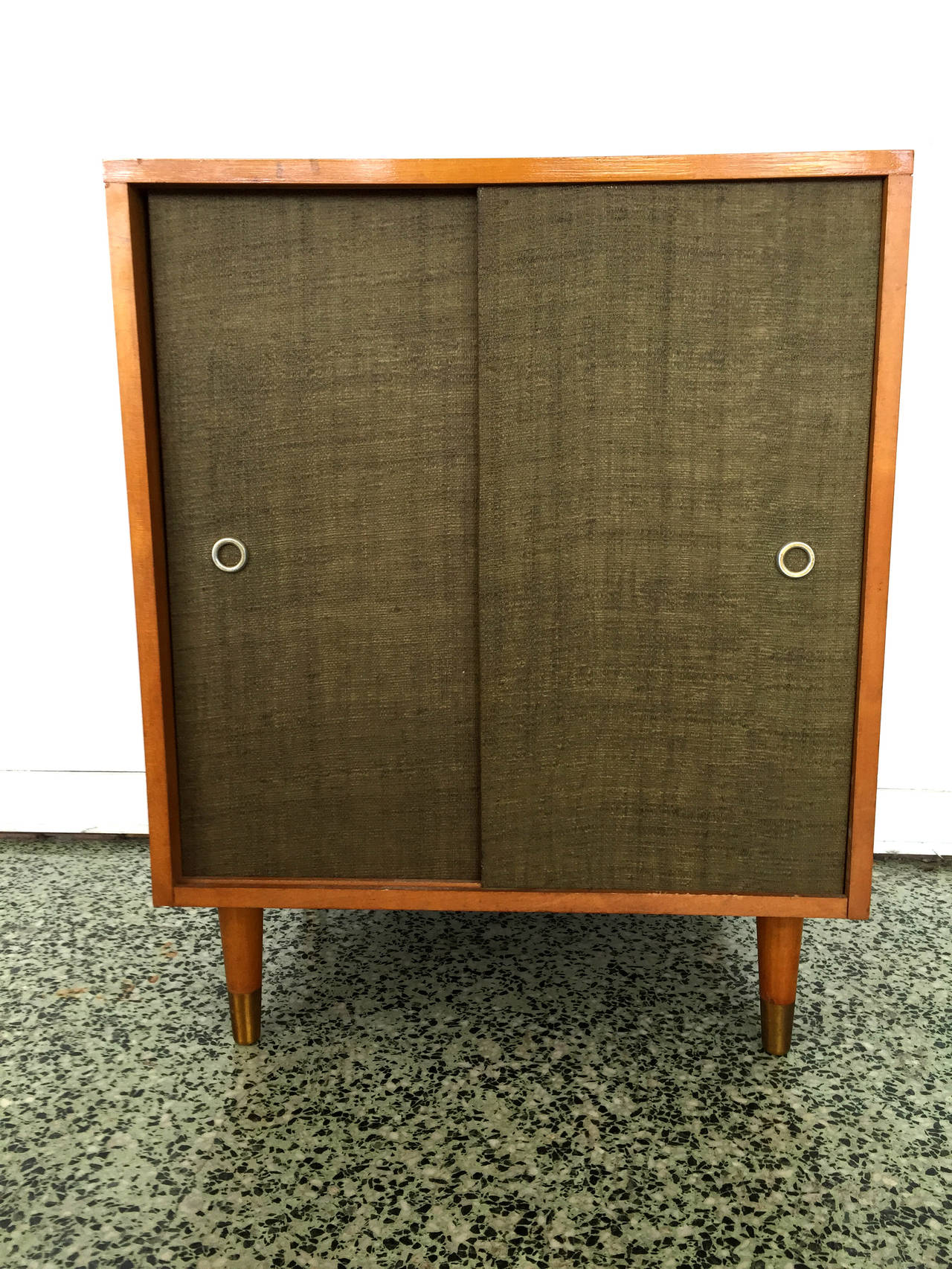 Grass cloth sliding door cabinet by Paul McCobb for Winchendon.
