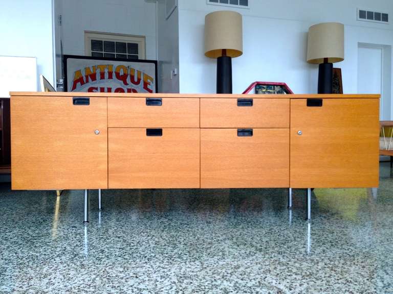George Nelson for Herman Miller credenza with 4 drawers and 2 doors that open to reveal shelving for storage. Companion executive desk also available.
