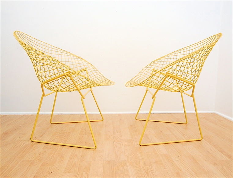 A pair of mid century modern Diamond lounge chairs designed by Harry Bertoia for Knoll. Profesionally repainted yellow.