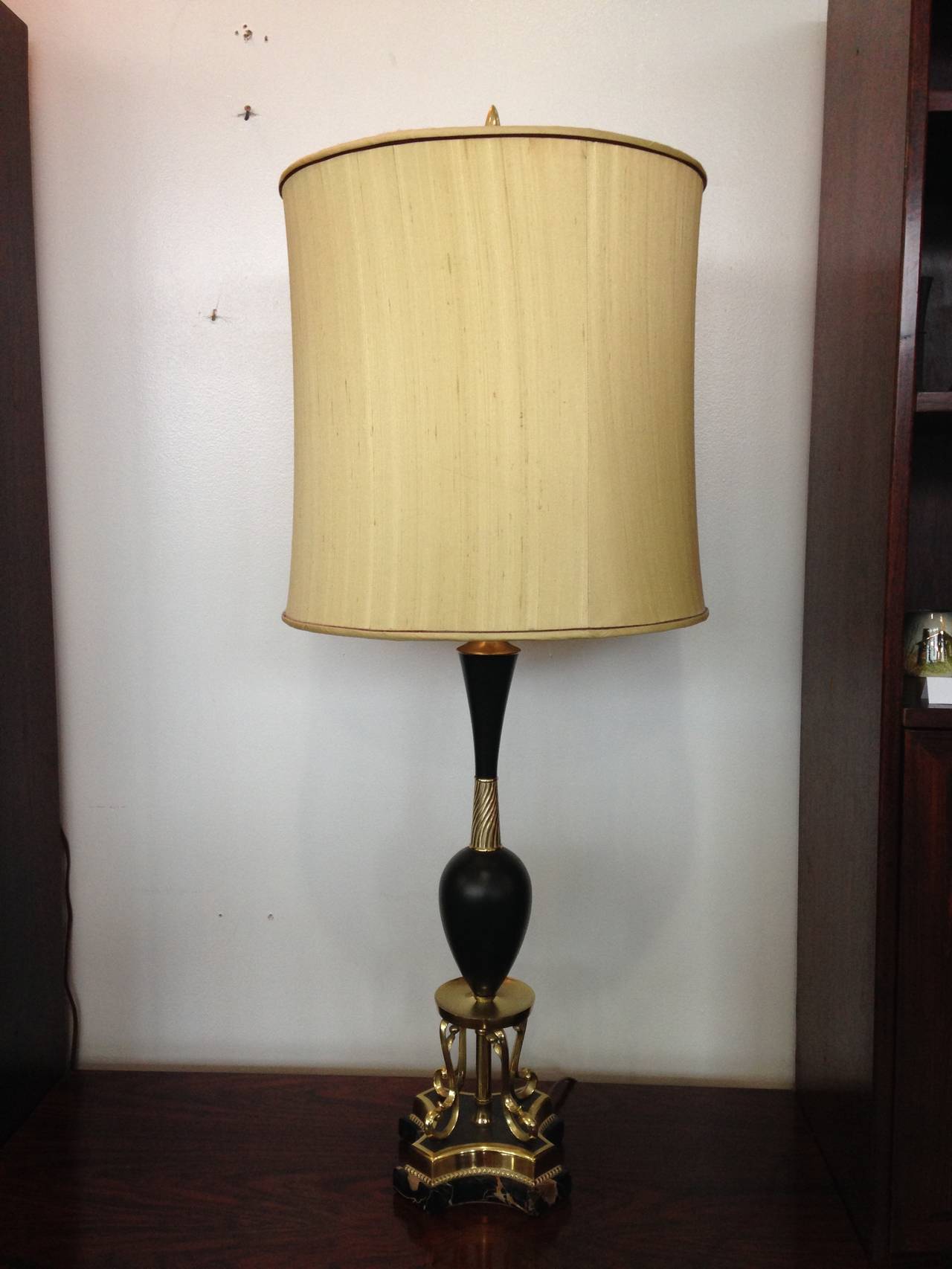 Beautiful pair of lamps in immaculate condition. No chips or issues to mentions on the lamps themselves. One shade has a tear on the inner linings. You can buy these lamps and not include the shades if you would like.