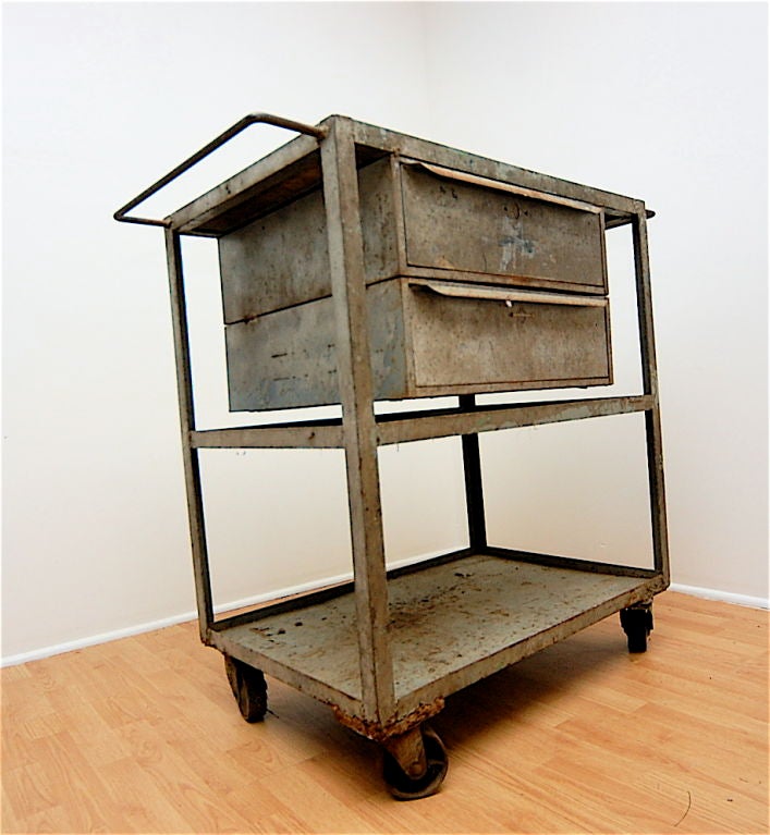 Great industrial metal cart on casters. Two floating drawers. Yes, this needs restoration.