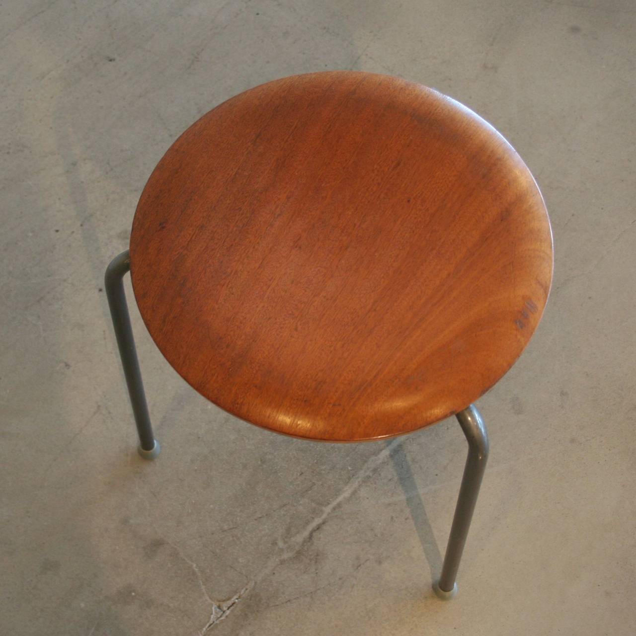 Adorable tri-pod stools with teak and bent-ply seats and steel legs. Sold individually.